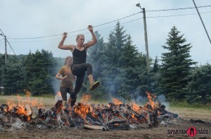 Deeay Shelly jumping over fire at the Spartan Race 2013